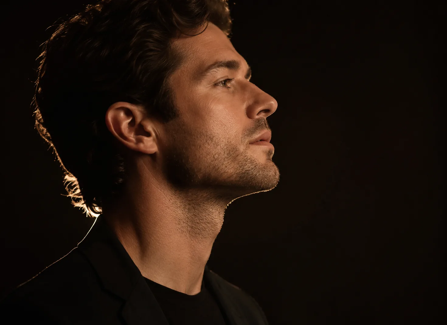 Profile of a man with a clean, taut neckline in warm side light